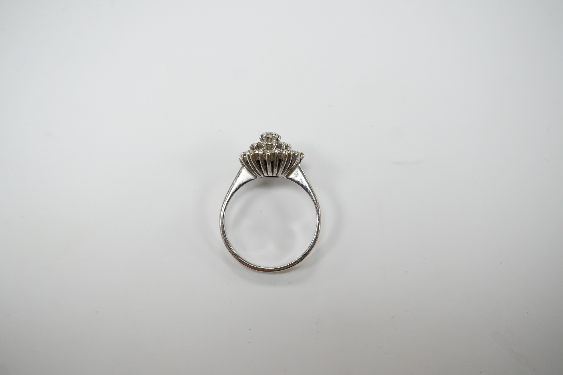 A 1970's 18ct white gold and diamond cluster set ring, size L, gross weight 3.2 grams, Condition - fair to good